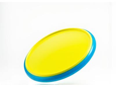 Aerodynamic, flexible flying disc in mid-air, designed for fetch.